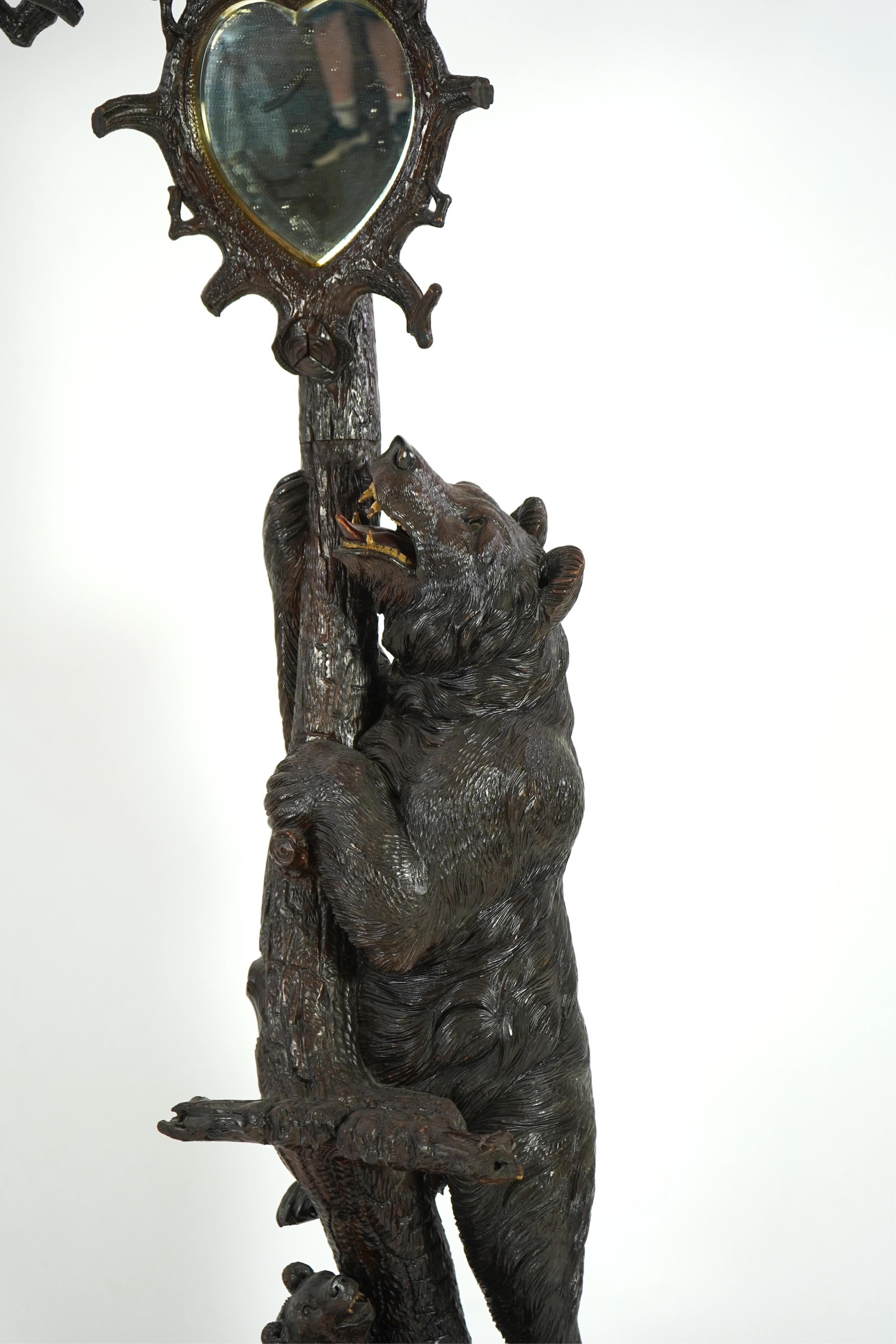 A late 19th century Black forest carved bear hallstand